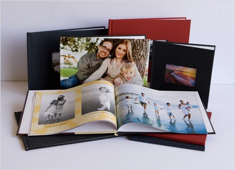 Styled open photo albums with family photographs